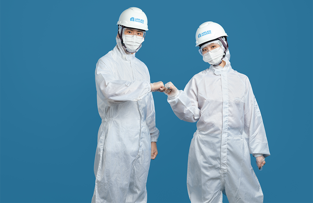 people in cleanroom clothing